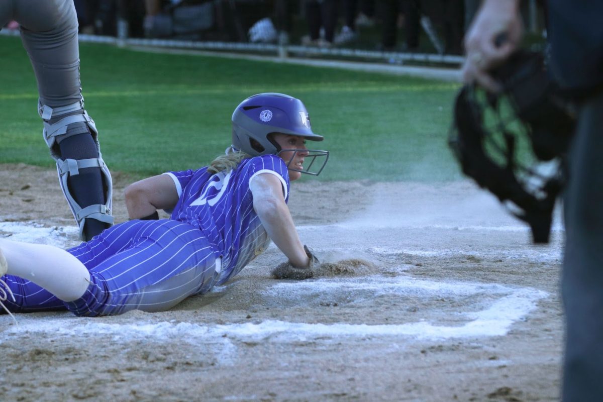 Lovett slides into home plate during the team’s game against Little Elm. The team won the game 10-0 on what was their senior night. Their season ended after losing to Plano East in the first round of the playoffs.