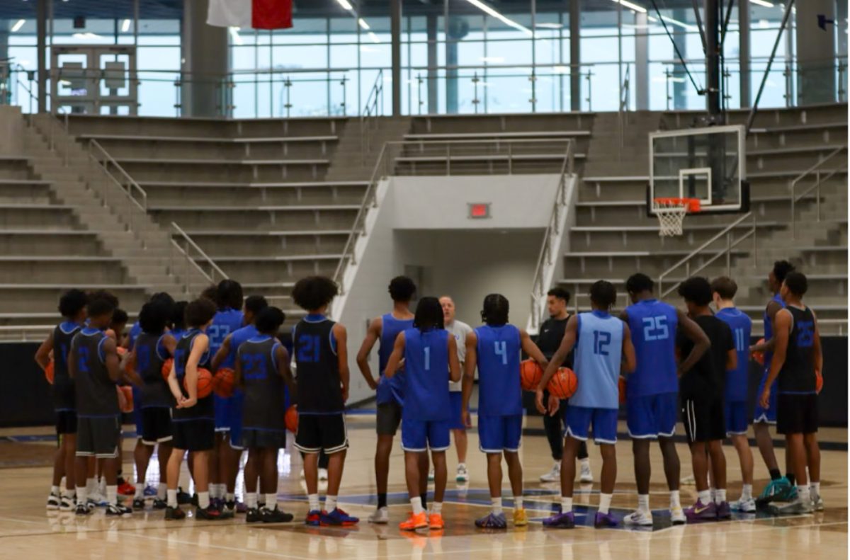 Head Coach Eric Reil giving the team a speech during practice a day before their upcoming game against Lamar.
