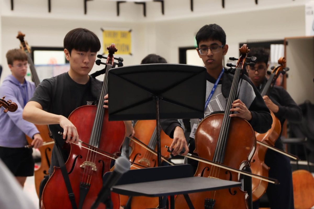 Juniors Ethan Kim and Vedanth Mukkamalla practice their cello in the chamber orchestra on Dec. 9. Orchestra will perform their annual winter concert Dec. 10 at 7 p.m. in The Colony High School’s auditorium.