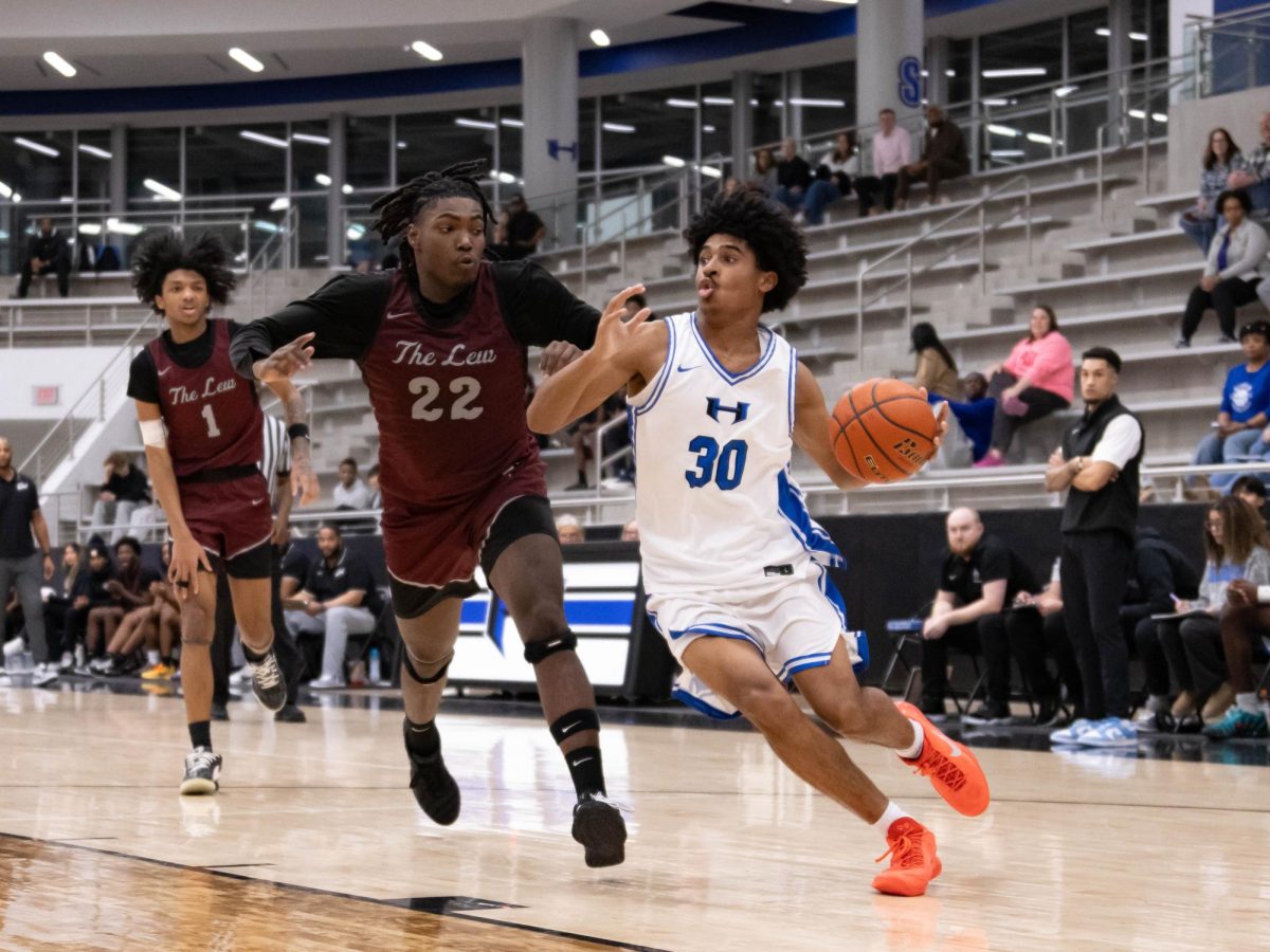 Guard Jevonaye Broussard drives against a Lewisville defender during the third quarter Feb. 3. The team lost the game 52-57.