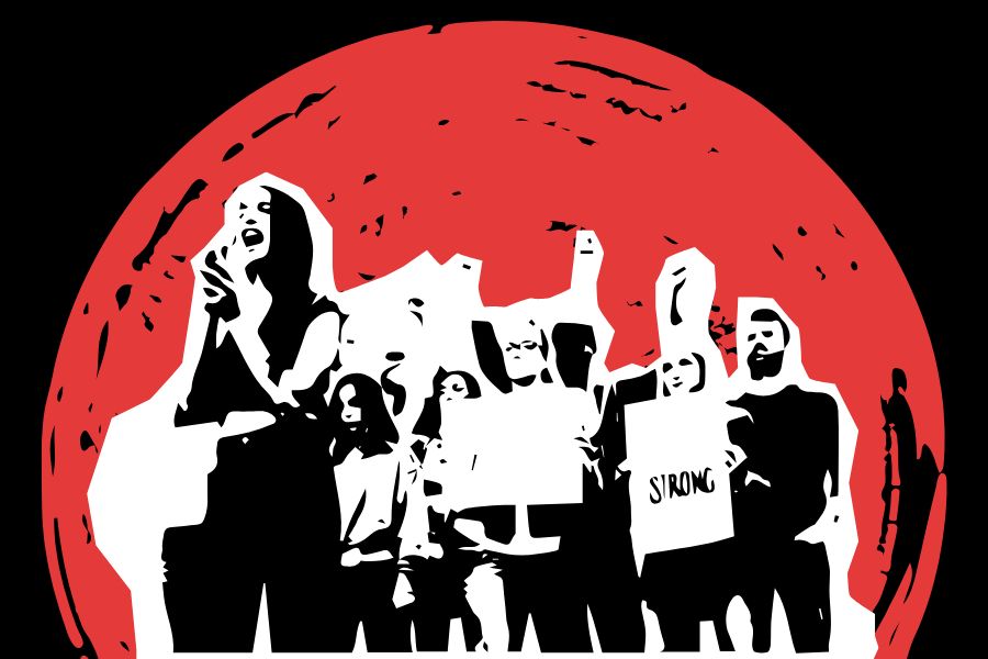 Protesters stand together in unison. From economic inequality and racism to housing insecurities, these problems are self-organizing and have evolved over time. 