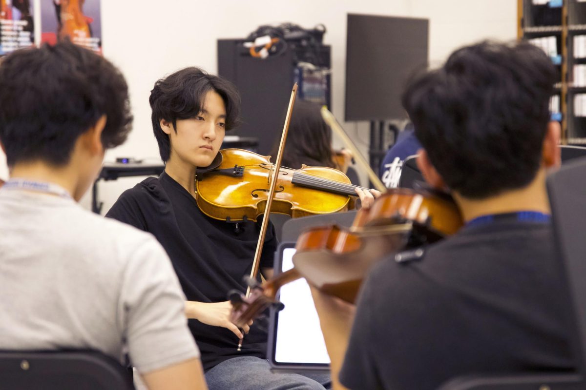 Violinist Ethan Jung practices with the orchestra April 28. Orchestra will perform their spring concert April 29 at 7 p.m. in The Colony High School’s auditorium.